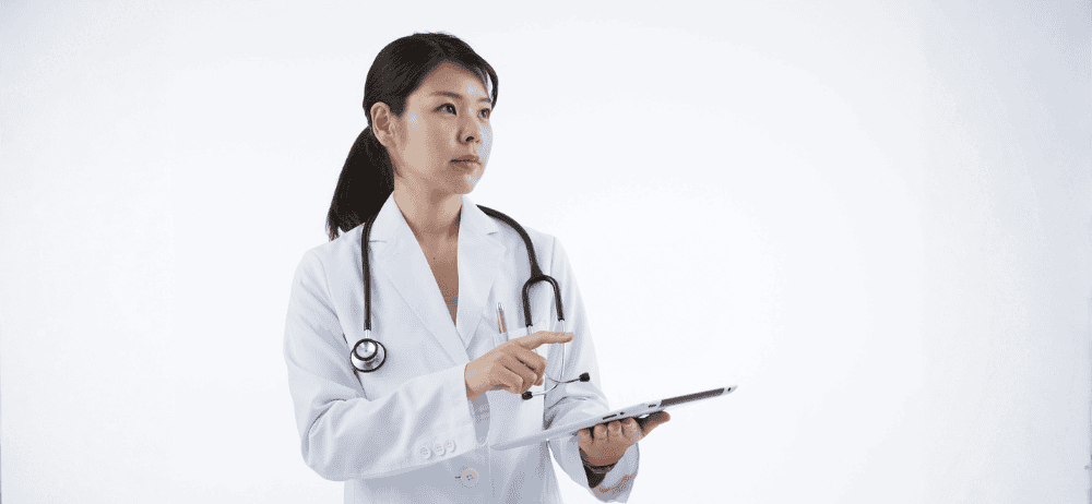 Doctor holding clipboard for infertility patient