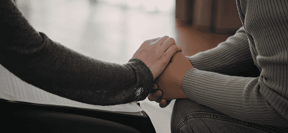 Close-up of hands holding each other for infertility